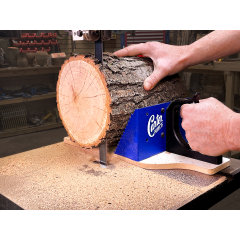 Safely cut round or odd shaped wood with the Carter Miter Mill.